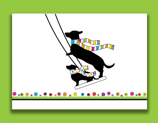 An any occasion card featuring dachshunds, Mali & Penny.  This any occasion card shows them enjoying themselves on a swing together. 