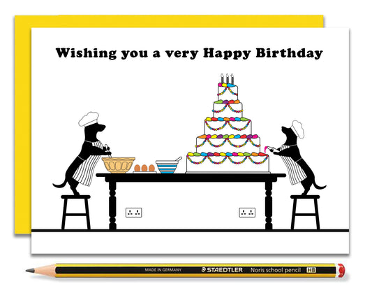 A fun dachshund birthday card featuring dachshunds, Mali & Penny baking and decorating a massive birthday cake.  Coupled with a bright, cheerful yellow envelope, with a pencil to show the scale of the card.