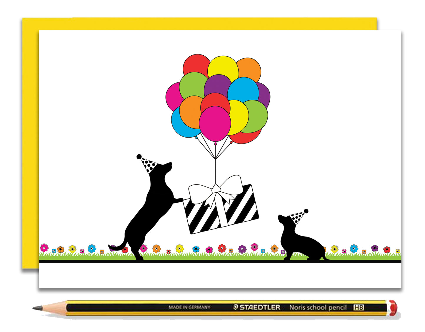 A fun dachshund birthday card featuring dachshunds, Mali & Penny.  This birthday card shows them holding down a present that's being lifted off the ground by rainbow coloured balloons.  Coupled with a bright, cheerful yellow envelope, with a pencil to show the scale of the card.