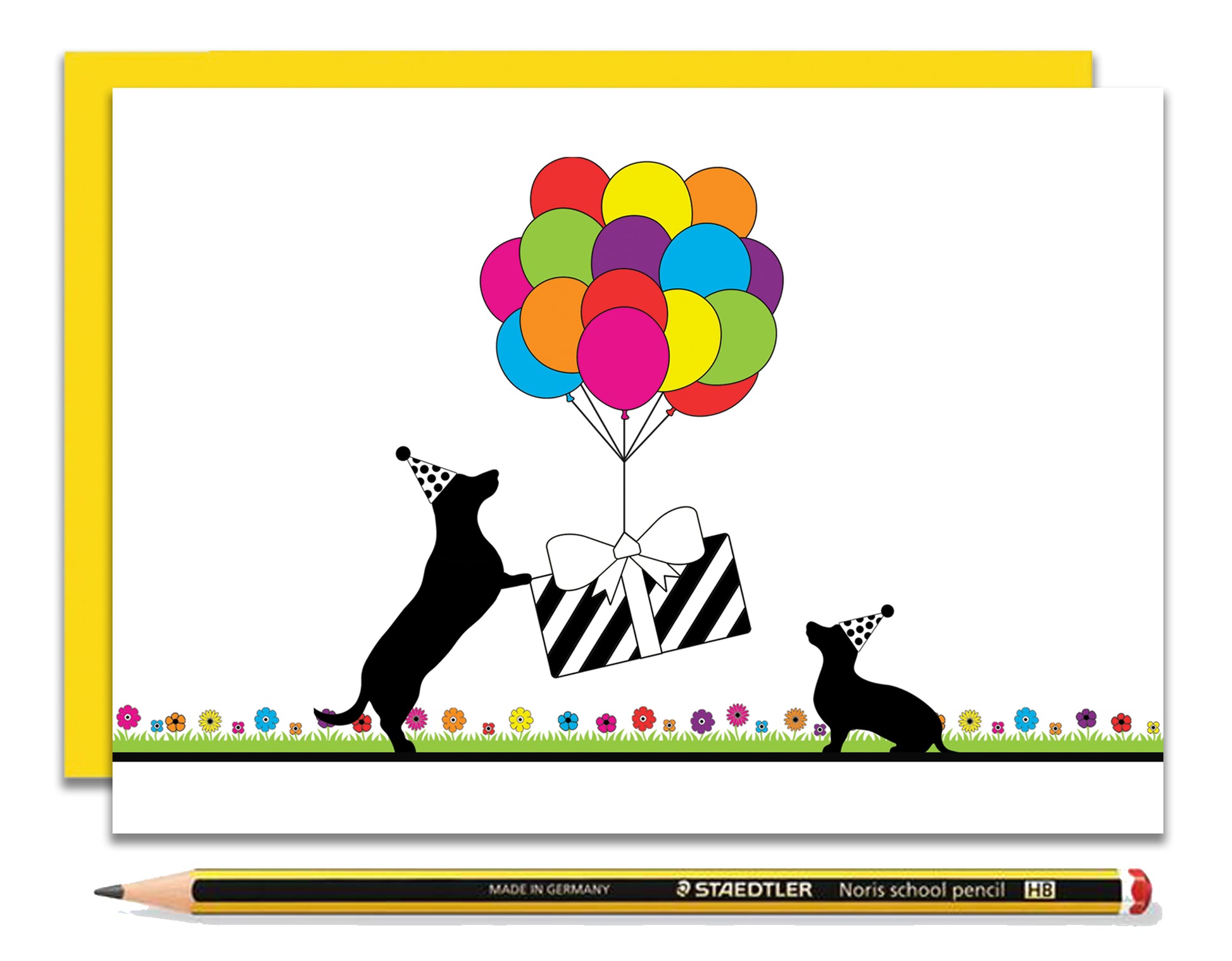 A fun dachshund birthday card featuring dachshunds, Mali & Penny.  This birthday card shows them holding down a present that's being lifted off the ground by rainbow coloured balloons.  Coupled with a bright, cheerful yellow envelope, with a pencil to show the scale of the card.
