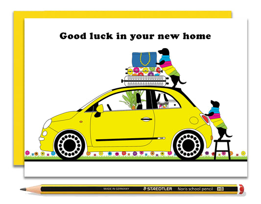 A fun new home card featuring dachshunds, Mali & Penny.  This new home card shows them loading their little Fiat with stuff for their new home.  Coupled with a bright, cheerful yellow envelope, with a pencil to show the scale of the card.