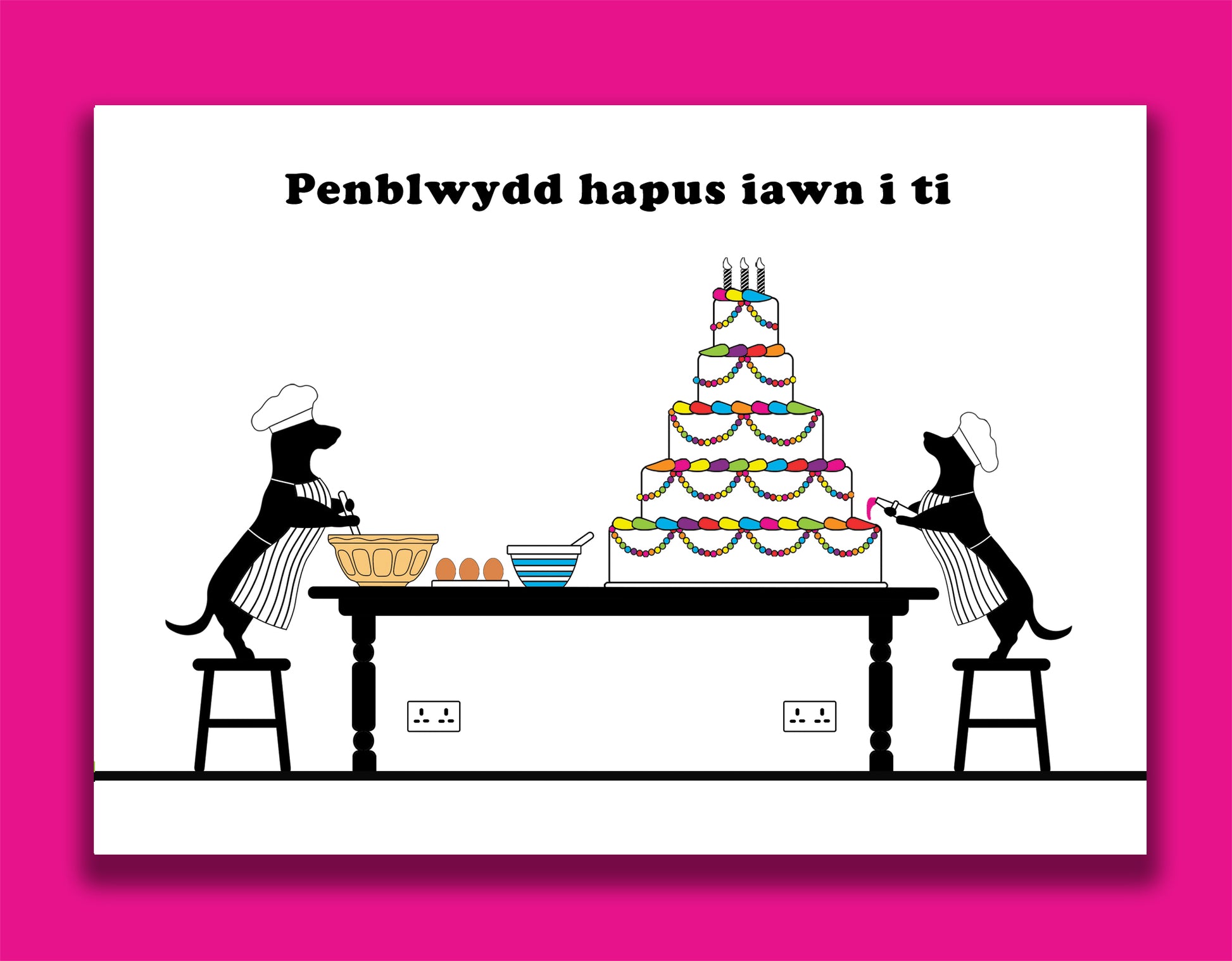 A Welsh birthday card featuring dachshunds, Mali & Penny.  This Welsh birthday card shows them baking and decorating a huge birthday cake.  Message reads - a very happy birthday to you.  