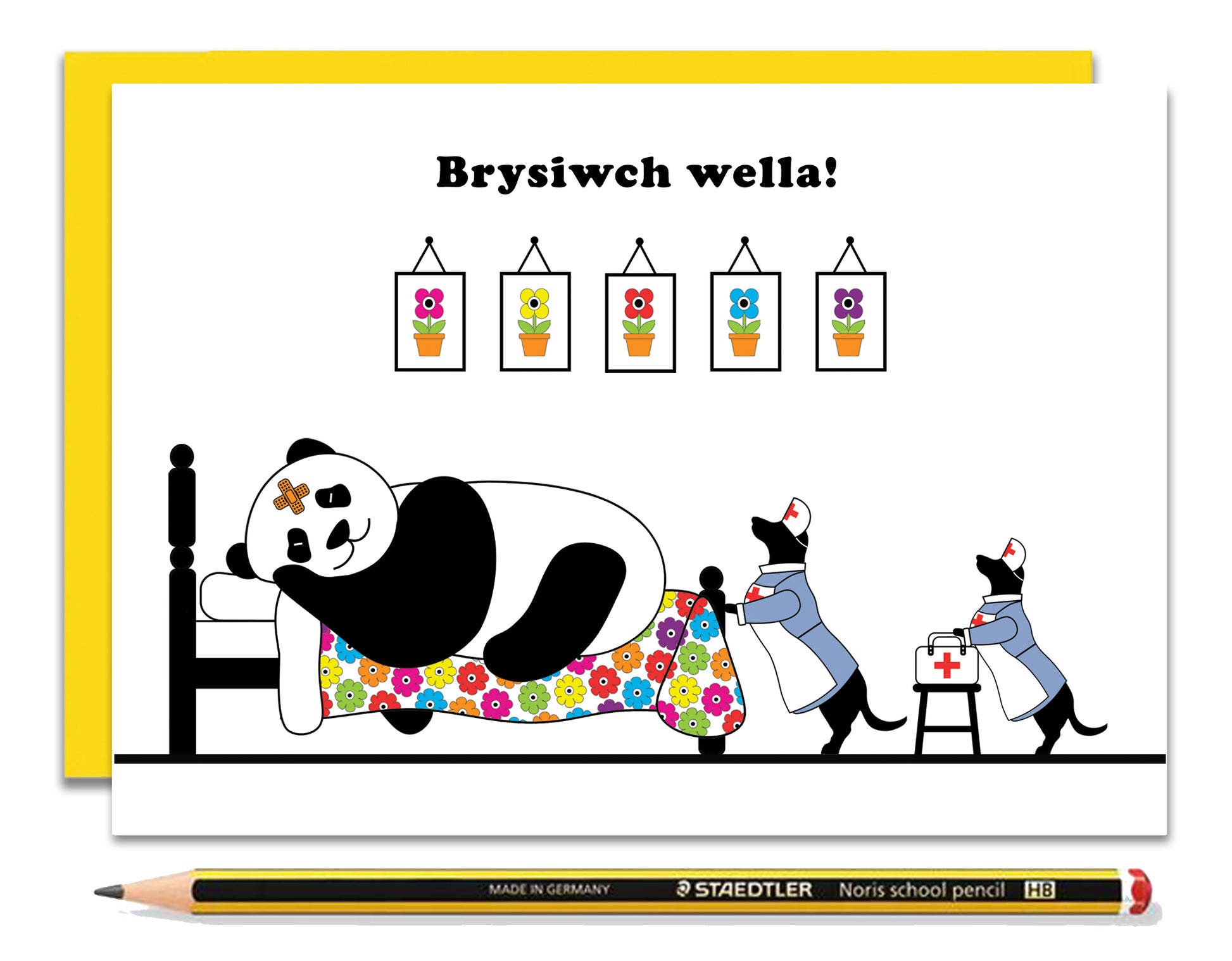 A Welsh get well soon card featuring dachshunds, Mali & Penny.  This Get Well Soon card shows them dressed as nurses looking after their poorly friend, Panda.  Message reads - get well soon.  Coupled with a bright, cheerful yellow envelope, with a pencil to show the scale of the card.